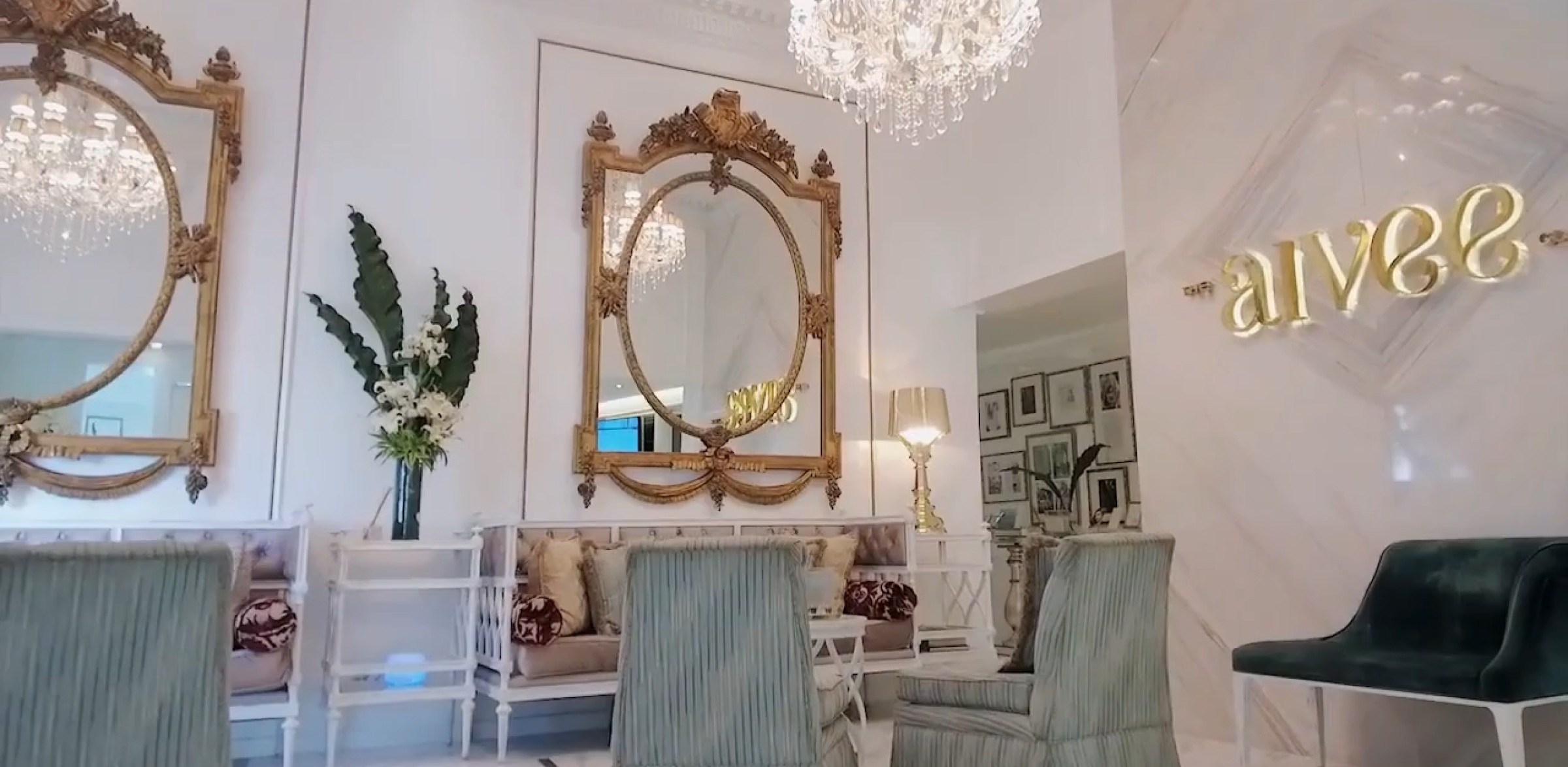 The chandelier-lit Aivee Clinic lounge with gilded mirrors and velvet seating