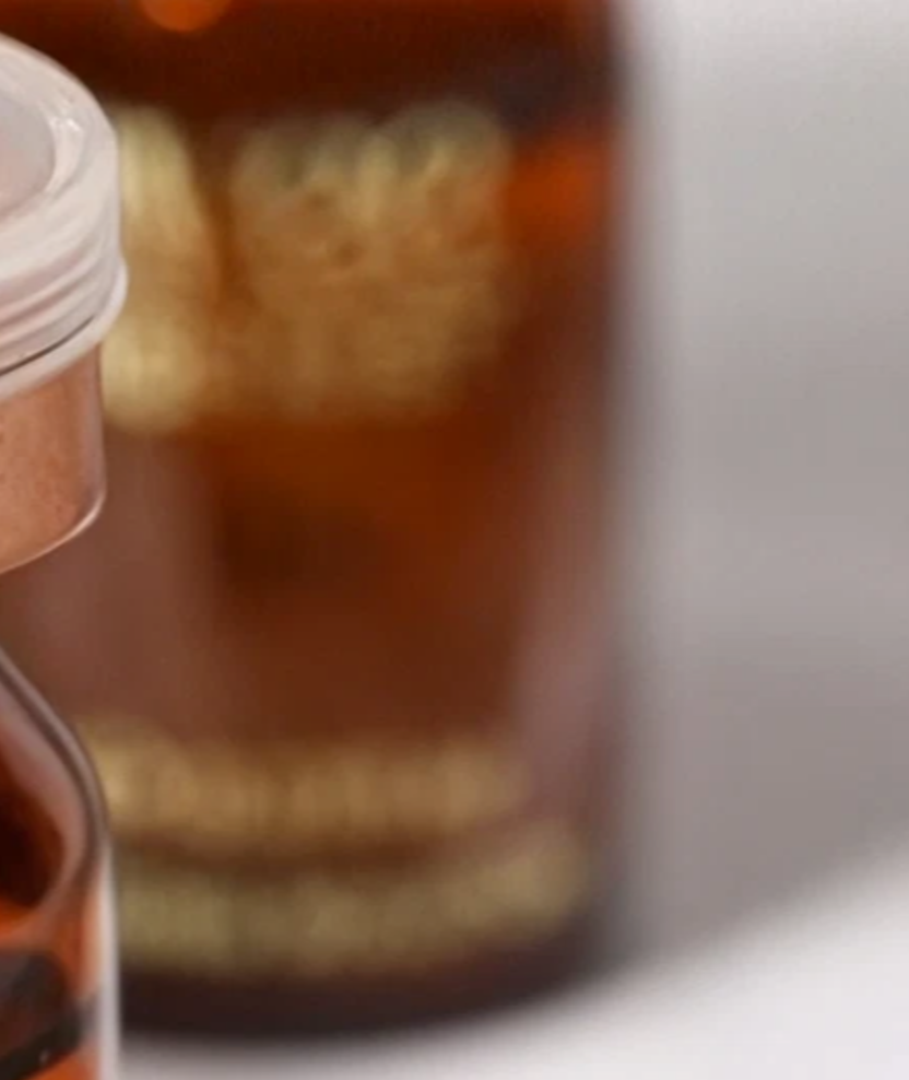 The upper body and copper cap of the Aivee Glass Mist vial
