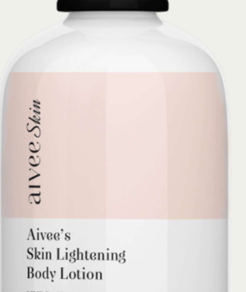 The base of the Brightening Vitamin C Serum bottle on its cream backdrop