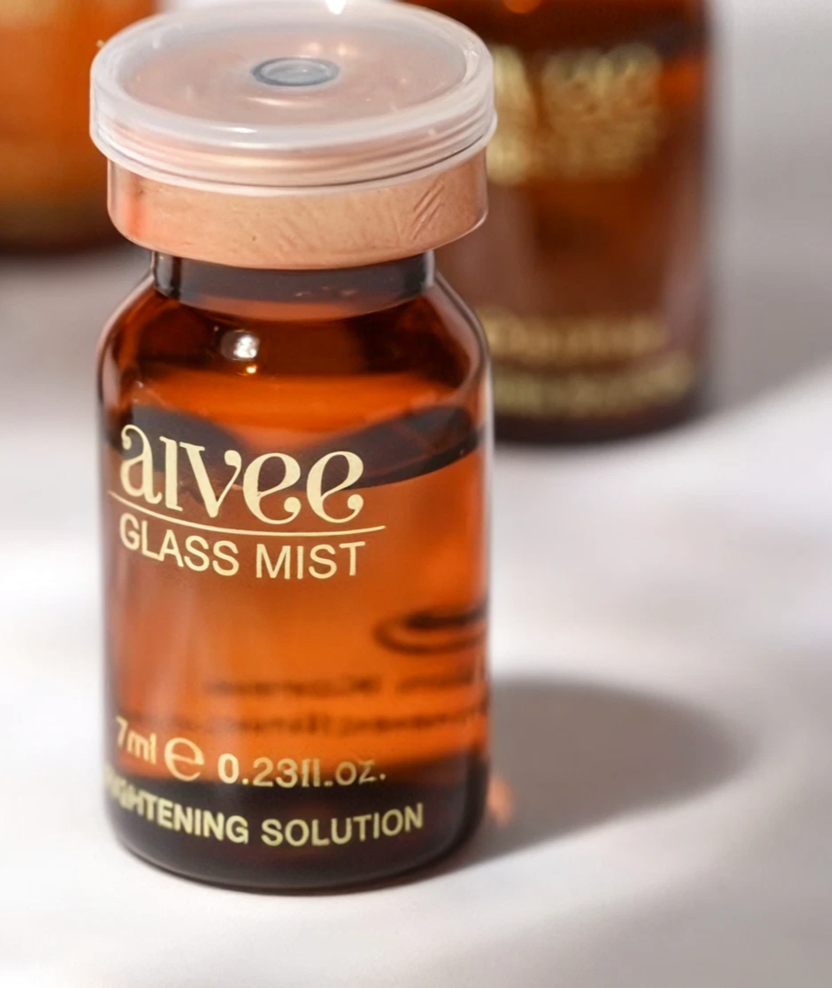 Hydrating Hyaluronic Serum amber vial with a copper cap against a soft cream backdrop