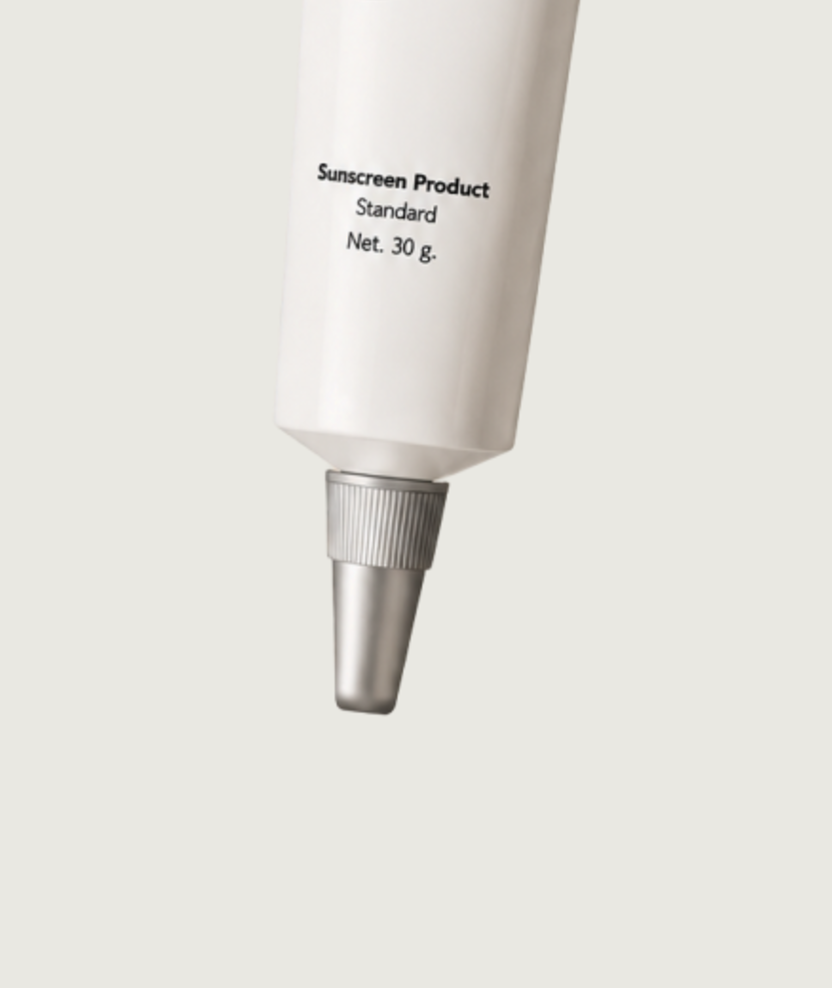 The lower body and nozzle of the Sunscreen Foundation Cream SPF40 tube on its cream backdrop
